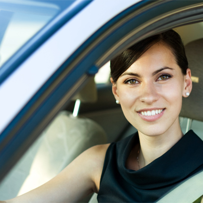 Smiling Woman in a Car