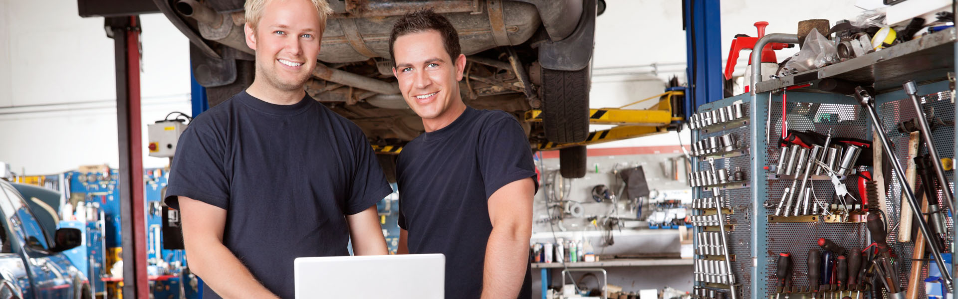Two Mechanics at the Car Repairing Center